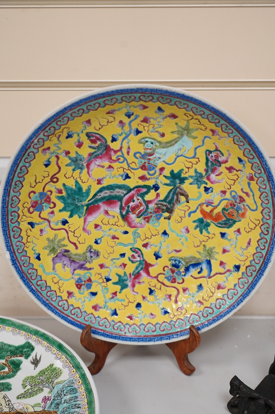 Oriental ceramics to include a Chinese yellow ground charger and a large famille noire vase, 47cm high (6). Condition - yellow charger chipped on rim, bird plate, glaze browned near centre, other four items good